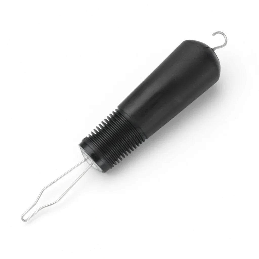 Button hook with black ergonomic handle for dressing, adaptive aid tool on white background