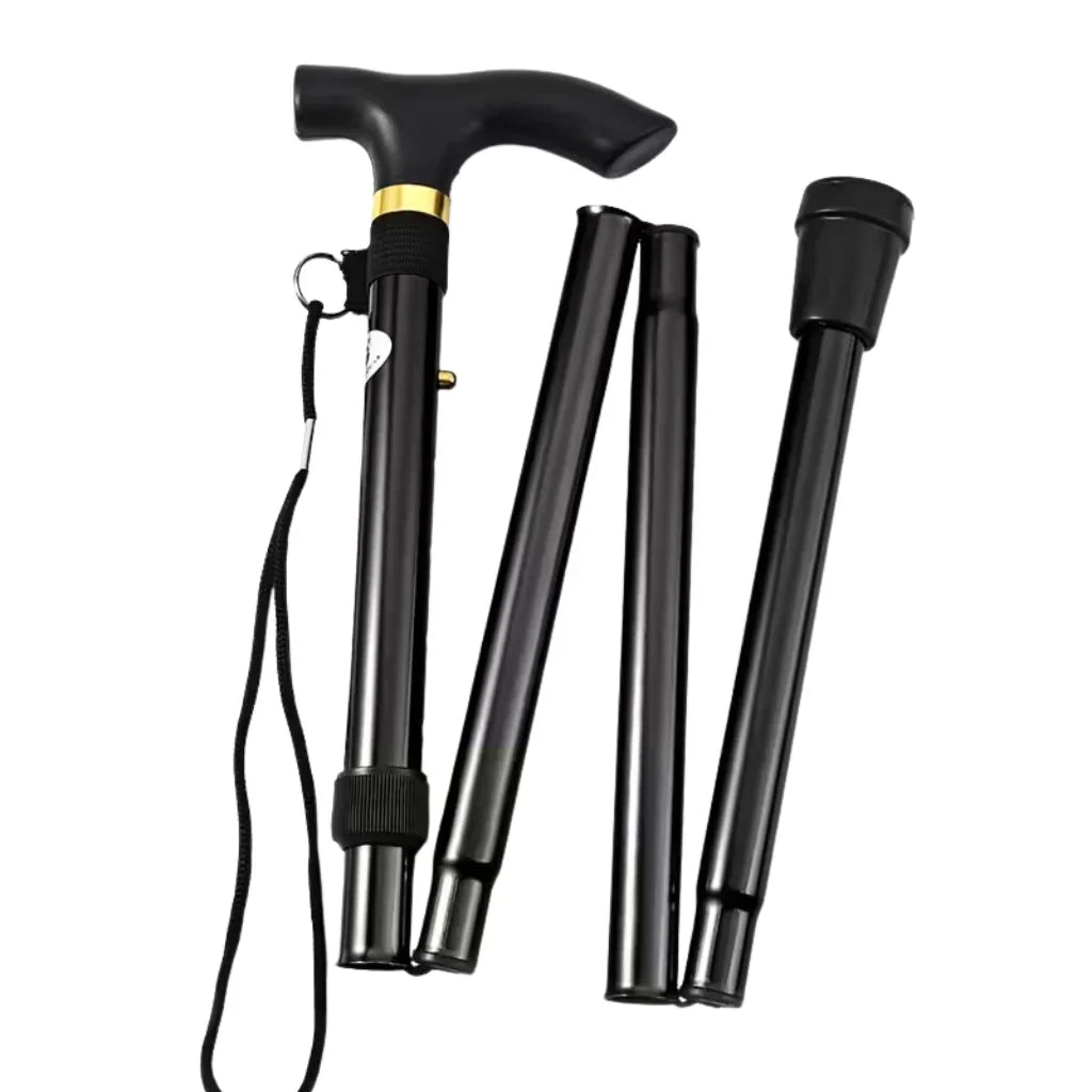 Black folding walking cane with ergonomic handle and wrist strap, adaptive mobility aid