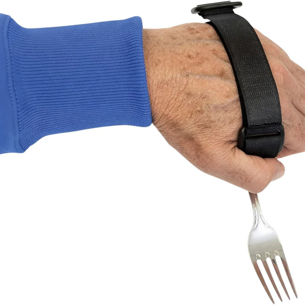 Hand using black adaptive utensil strap to securely hold a fork, ideal for limited mobility