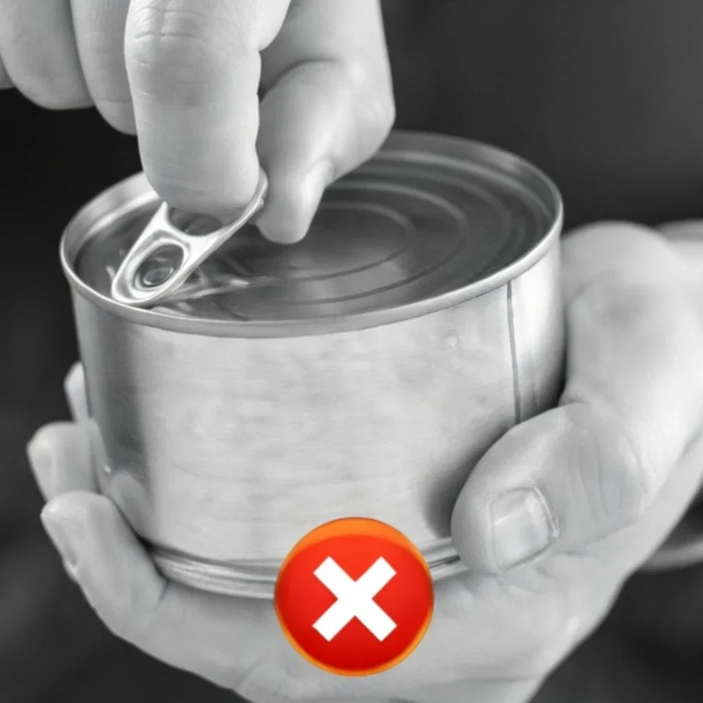 Hand struggling to open can lid with ring pull, red X symbol indicating difficulty