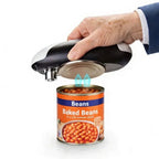 Electric can opener being used to open a can of baked beans