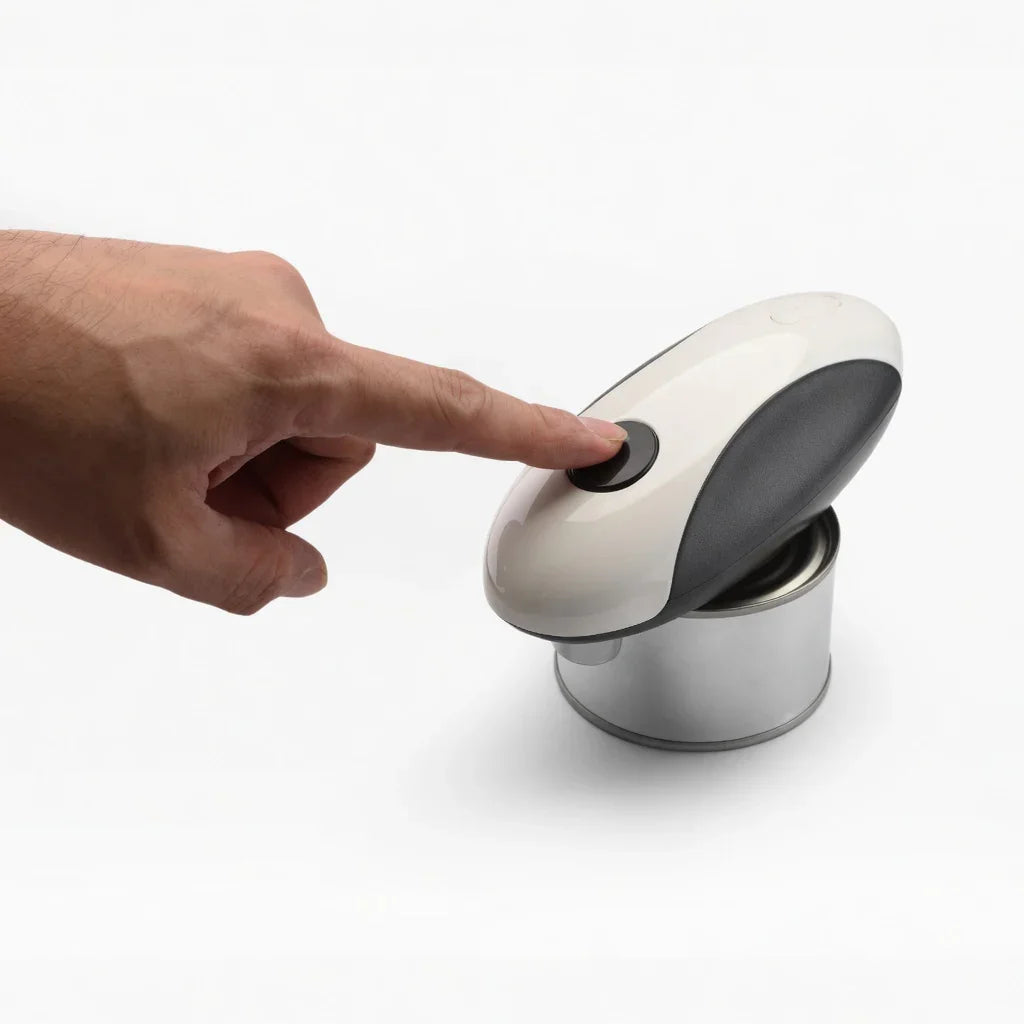 Hand pressing electric can opener button on metal can, adaptive kitchen aid for easy opening