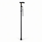 Adjustable black walking cane with ergonomic handle and wrist strap for mobility support