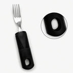 Adaptive fork with thick, ribbed black handle for easy grip, close-up of handle hole