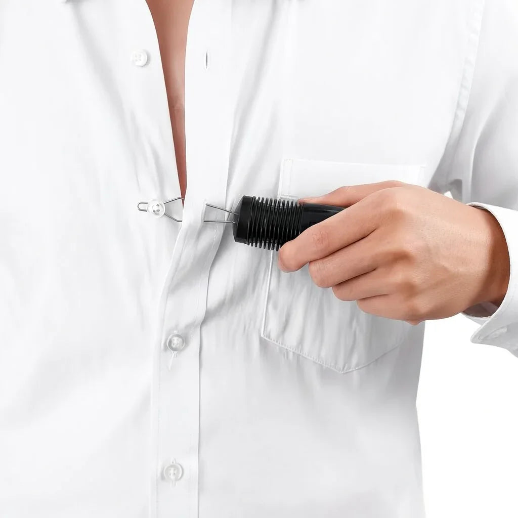 Hand using a button hook aid to fasten buttons on a white shirt, adaptive dressing tool